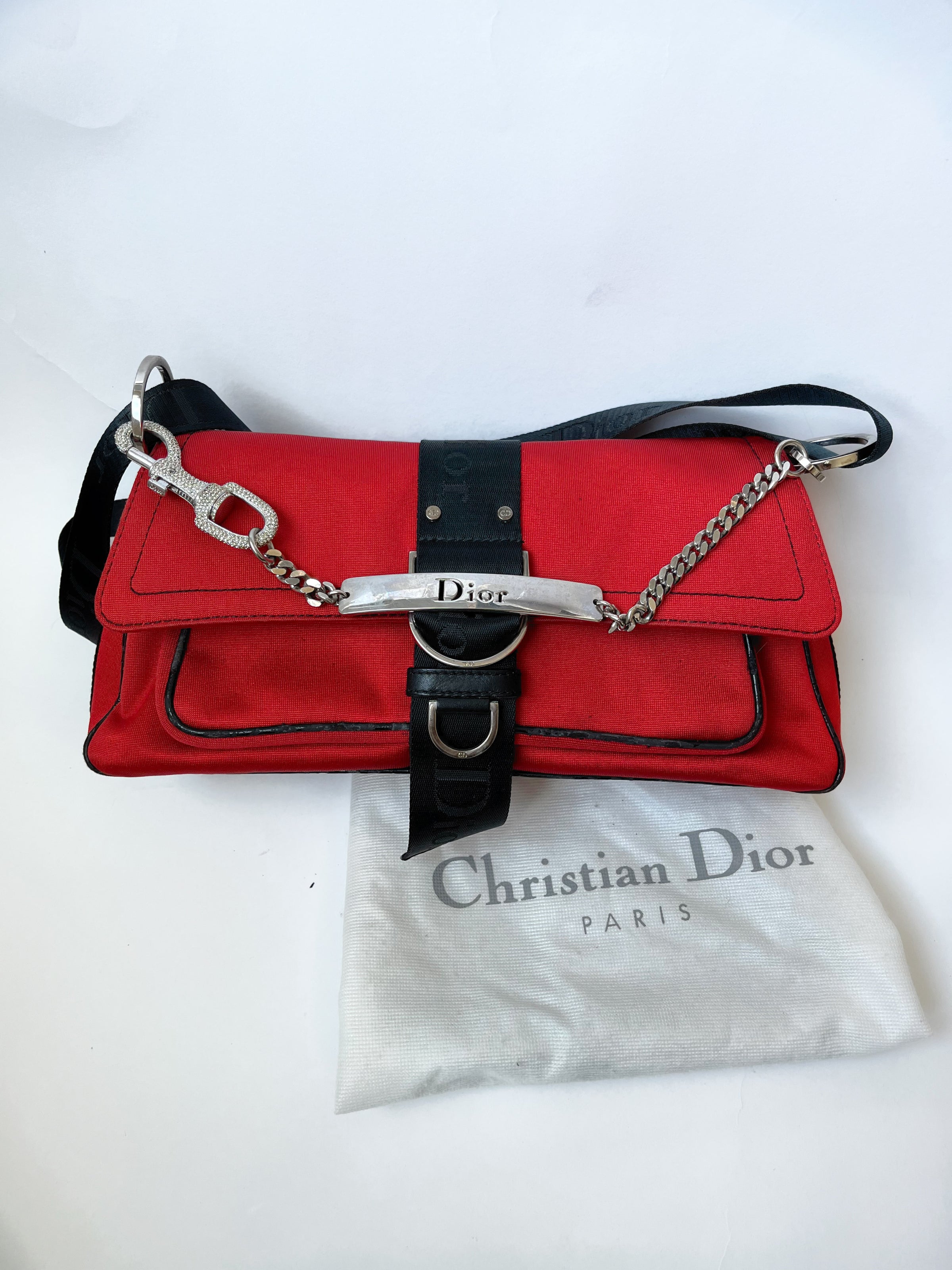 AUTHENTIC Vintage Christian Dior black/gray monogram trotter pochette bag.  Adjustable strap. The bag has a bit of wear but not…